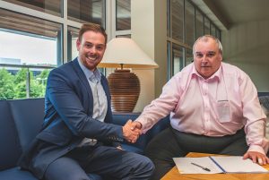 John Scullion Signing Contract
